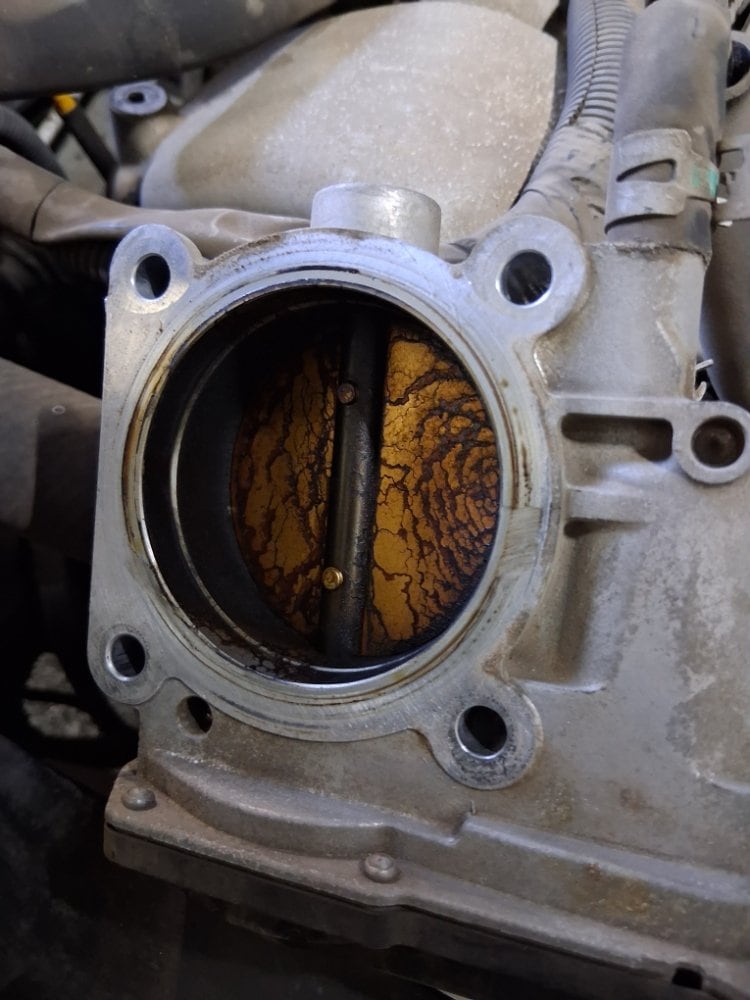 Carbon-caked throttle body, as it came in